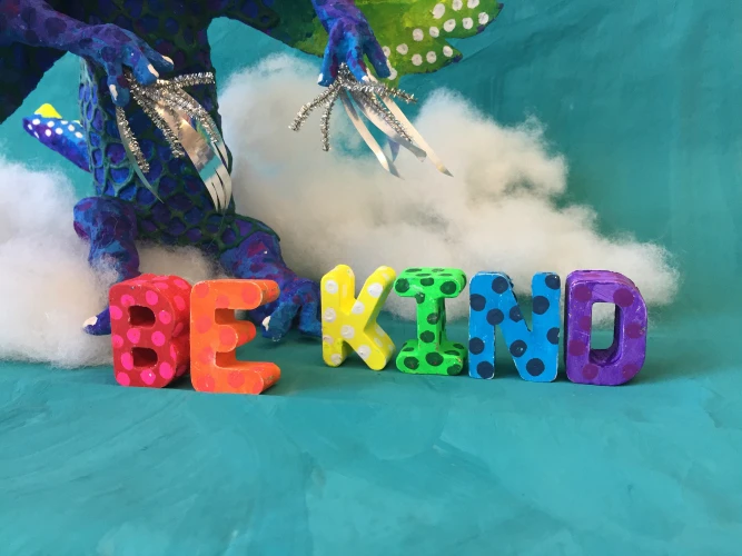 PermaStone casted letters spell "Be Kind"